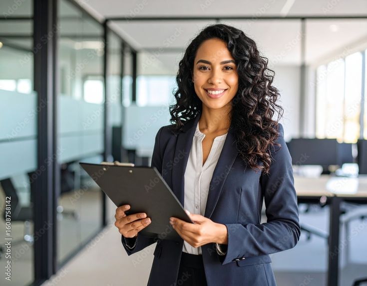 Smiling Businesswoman with Clipboard Stock Photo